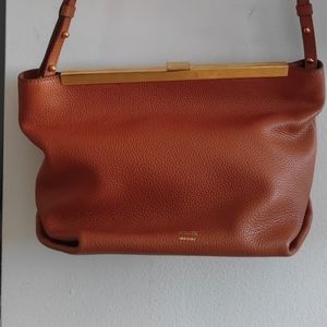 Khaite - Augusta Crossbody bag in Sienna Orange